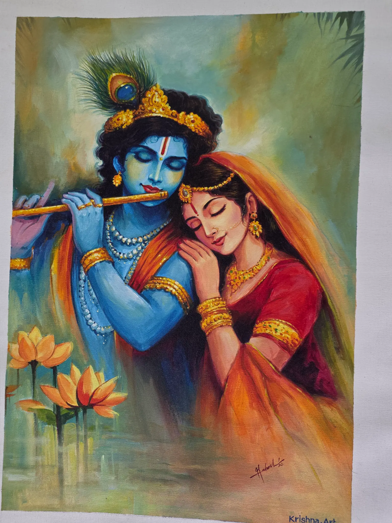 Radha Krishna with Lotus displayed in a pooja room